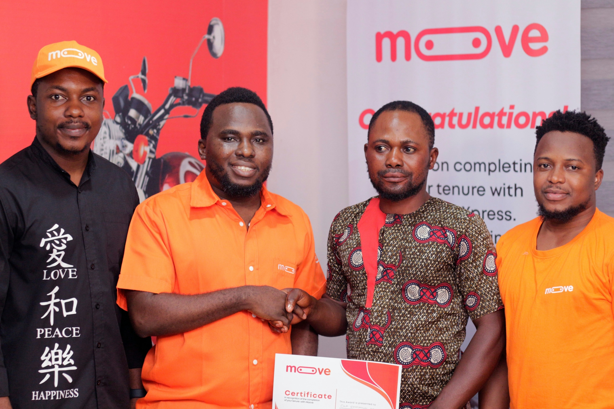 Moove Customers in Ibadan, Nigeria celebrating full ownership of their vehicles. L to R: Timi Ayoade, Senior Manager for Customer Acquisition & Onboarding at Moove, Gbolahan Ajijola, Mooves Country Manager for Nigeria, Ola Emmanuel Orisumibare, Moove cust
